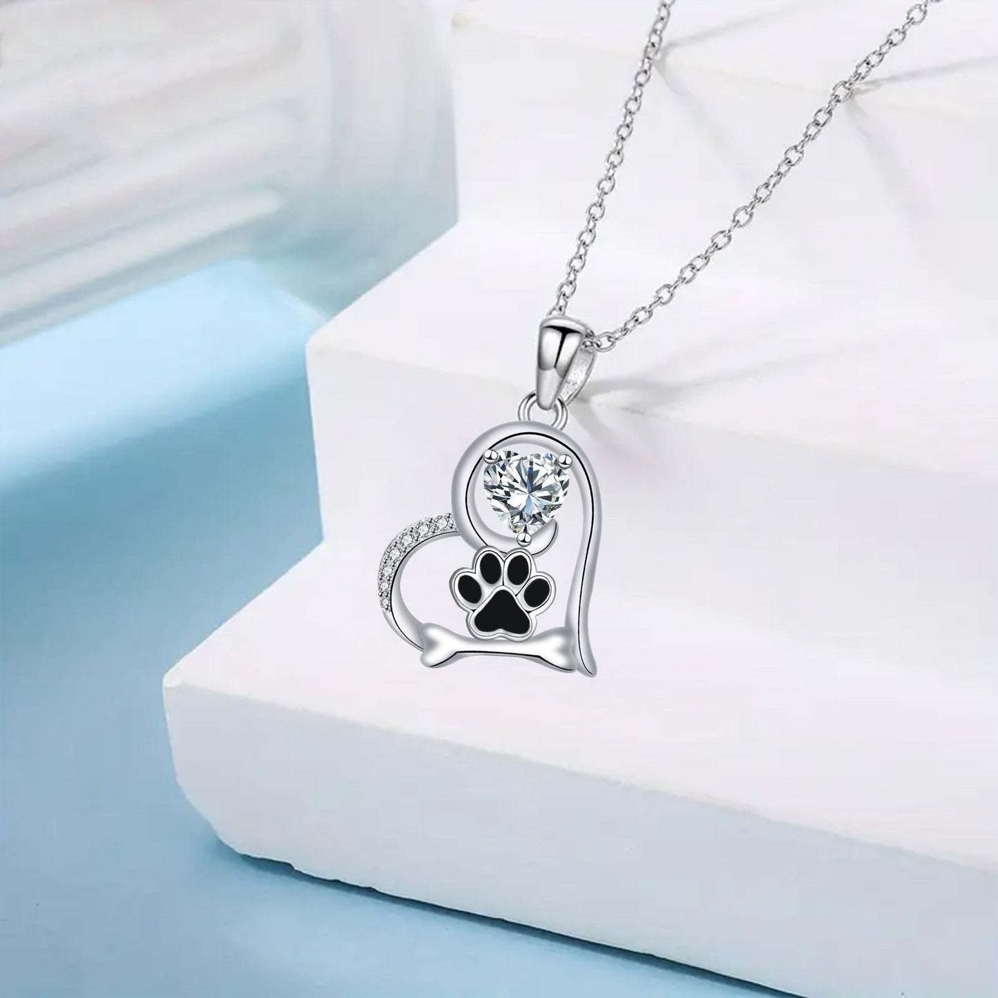 Handcrafted Dog Paw Print and Bone Necklace with Zirconia™